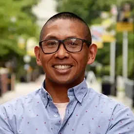 Headshot of Sam Ochinang